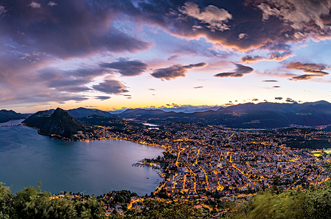 The sun sets on Lugano, in southern Switzerland